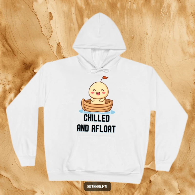 Funny Hoodie: A cheerful soybean character in a small boat, conveying a sense of happy adventure and cozy comfort in a humorous design.