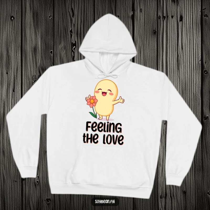 Funny kawaii soybean character joyfully hugging a flower with open arms, depicted on a cozy hoodie.