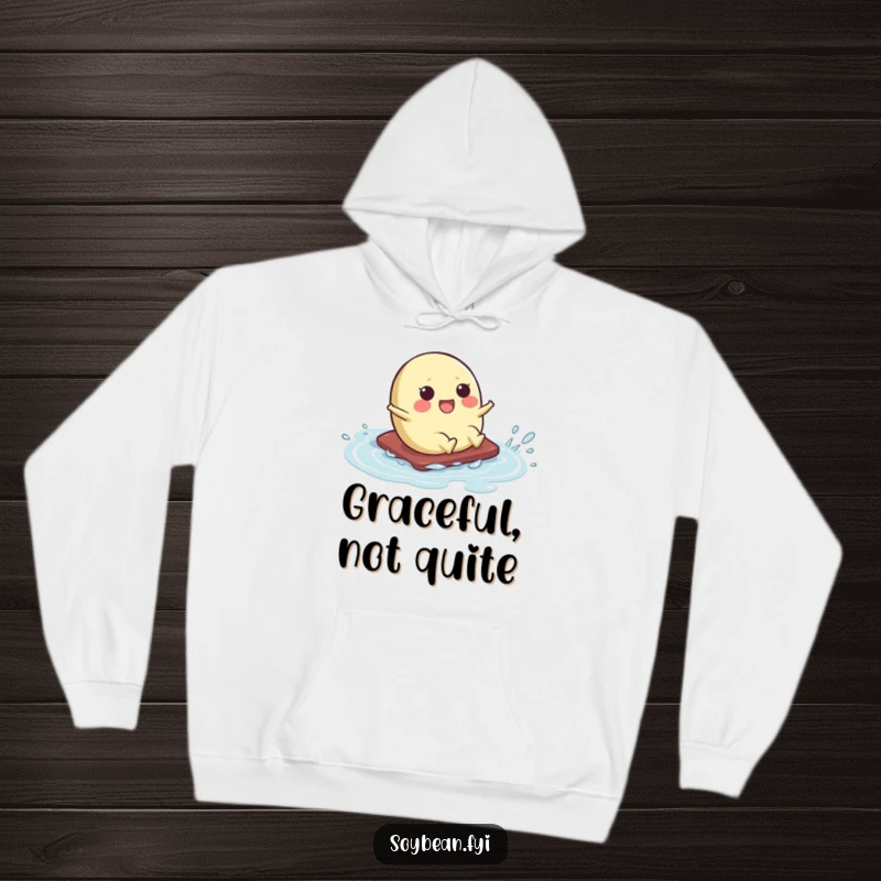 Funny hoodie with a kawaii soybean character humorously sliding across a wet surface, their motion captured with amusing flair.