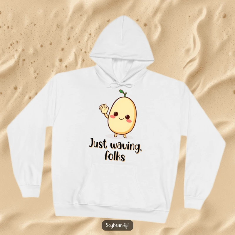 Funny hoodie with a smiling soybean character giving an amicable wave, perfect for comfortable, cheerful wear.