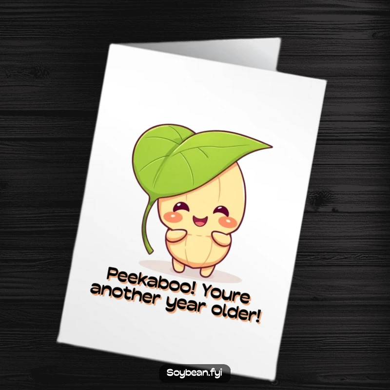 Funny Free Printable Birthday Card: Giggling kawaii soybean character plays peek-a-boo behind a large leaf, perfect for birthday fun.